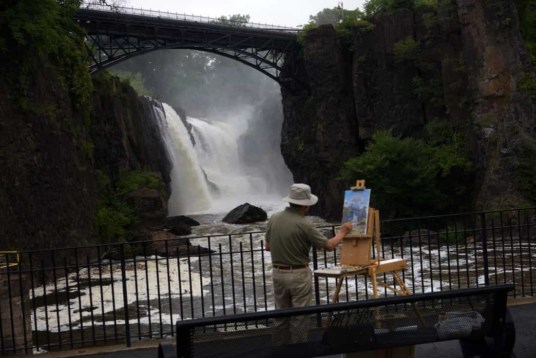 image of painter painting the great falls